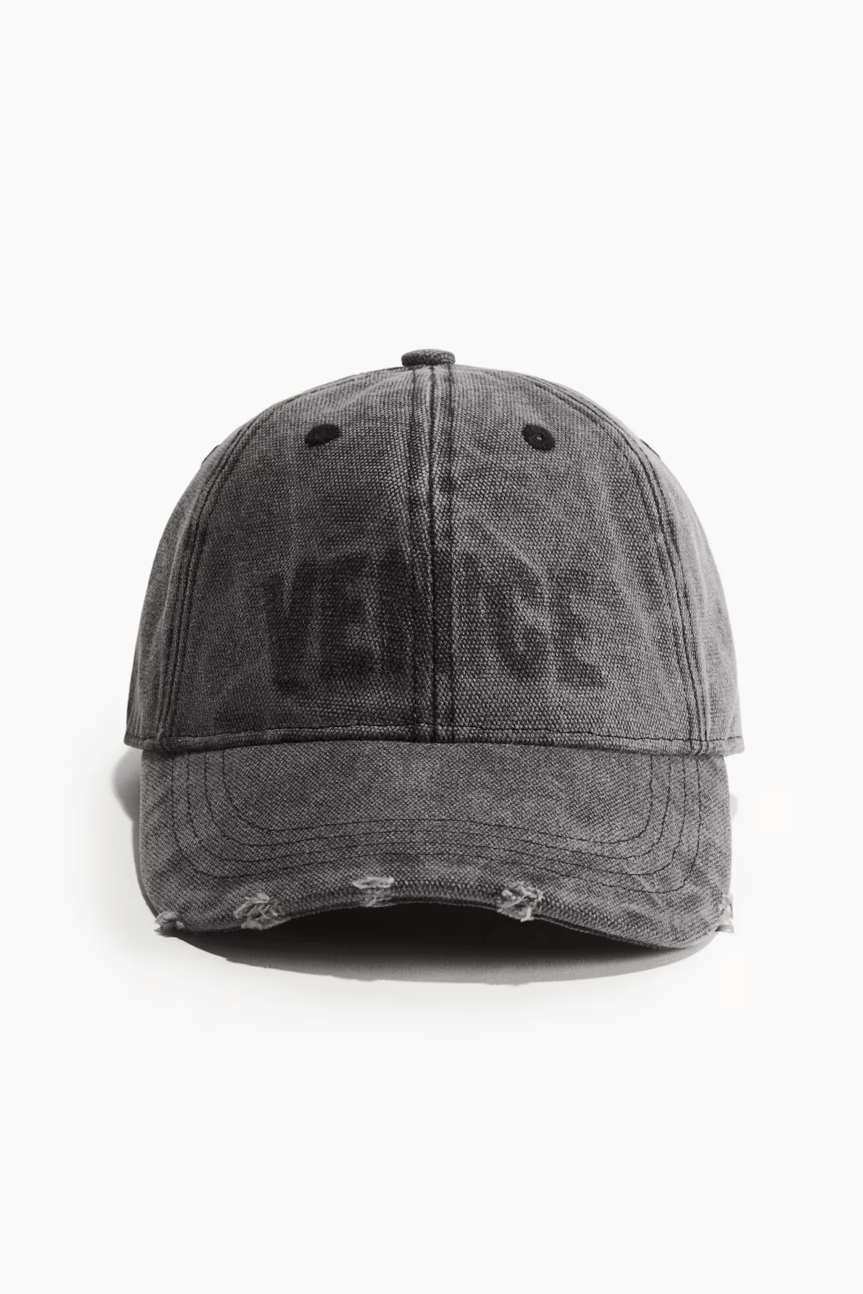 Cap with hard-worn details